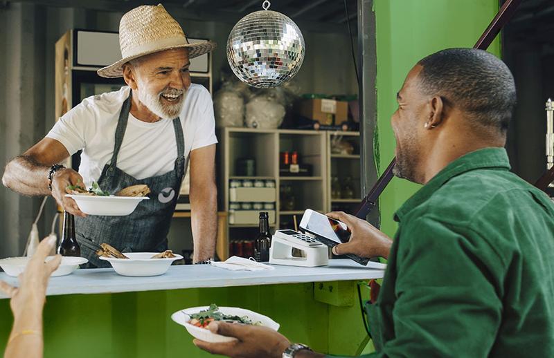 Customer paying at a shop